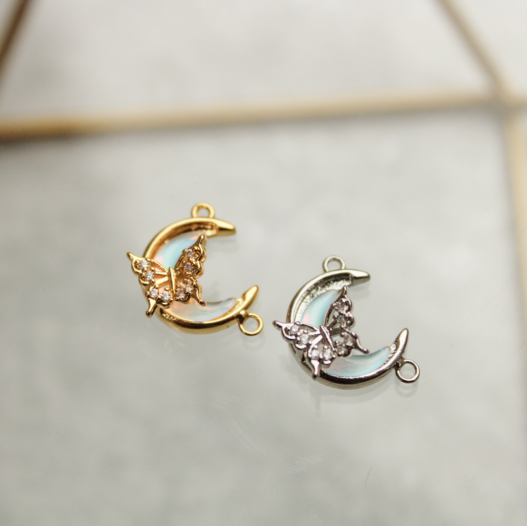 Dije media luna y mariposa con zircones en rodio