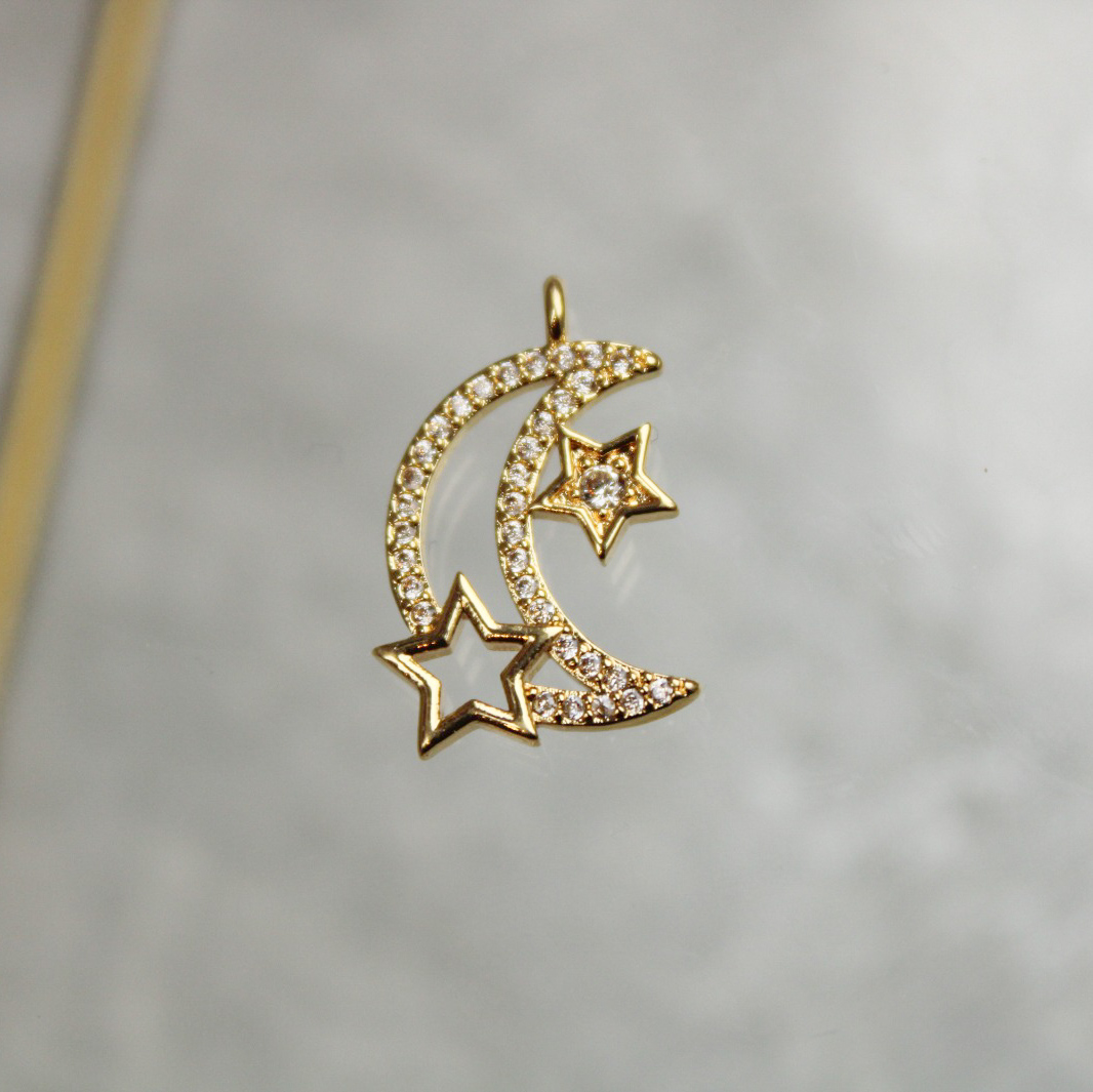 Dije media luna y estrellas con zircones en rodio