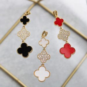 Dije largo Van Cleef con zircones en rodio