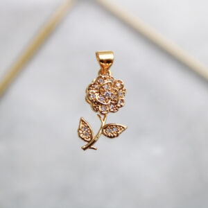 Dije flor antiestrés con zircones en rodio