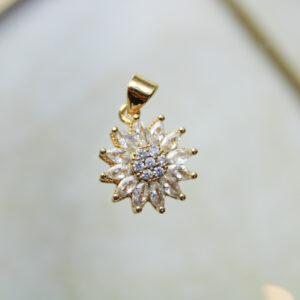 Dije flor con zircones antiestrés en rodio
