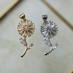 Dije flor con zircones antiestrés en rodio