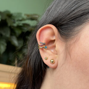 Earcuff estrella con zircones multicolor en rodio