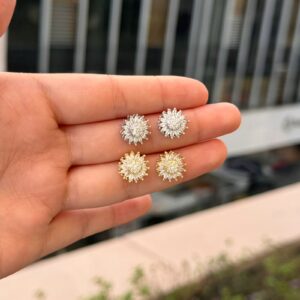 Topo flor giratoria con zircones en rodio